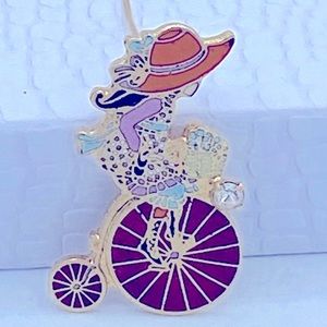 Vintage1977 Roth G.C. Inc. Collectible Girl On Victorian Bicycle Lapel Pin